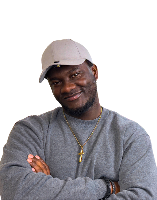 Gabriel with arms crossed, wearing a grey sweatshirt, cap, and cross necklace
