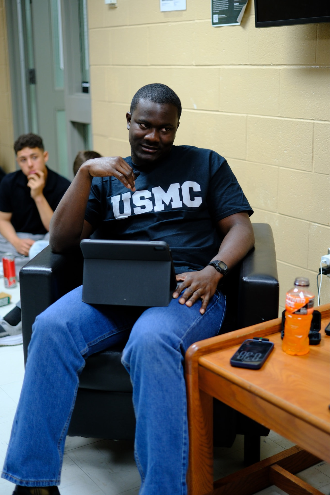 Gabriel seated and engaged in a community discussion